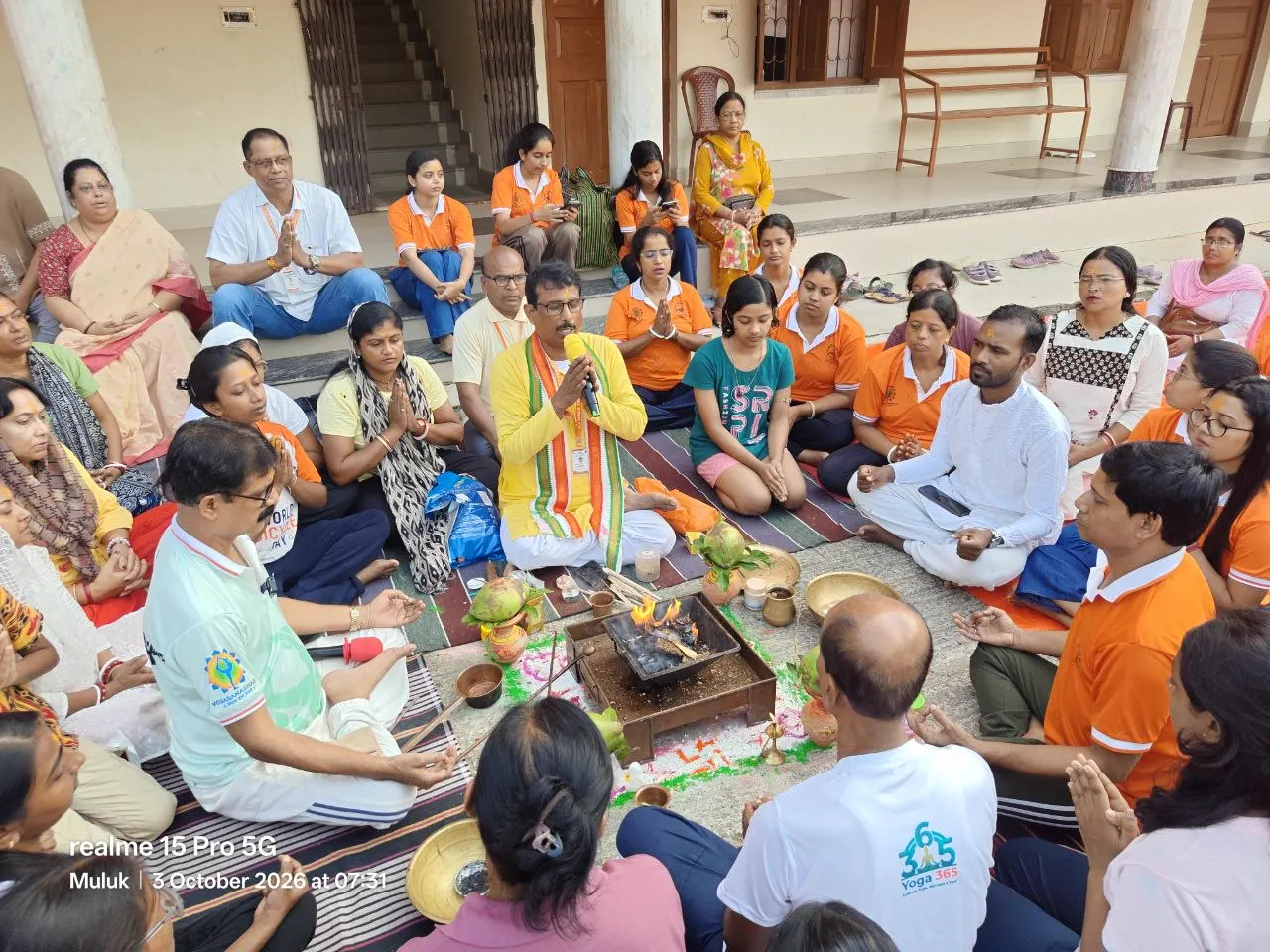 Shyamal Ta, State President of the All Bengal Yogasana Sports Association, sits beside the fire offering at Bharat Sevashram Sangha, Muluk.